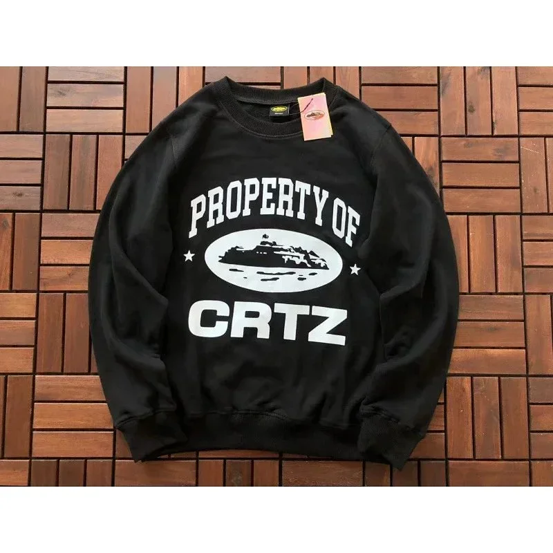 Corteiz Black crewneck sweatshirt with "PROPERTY OF CRTZ" & graphic print